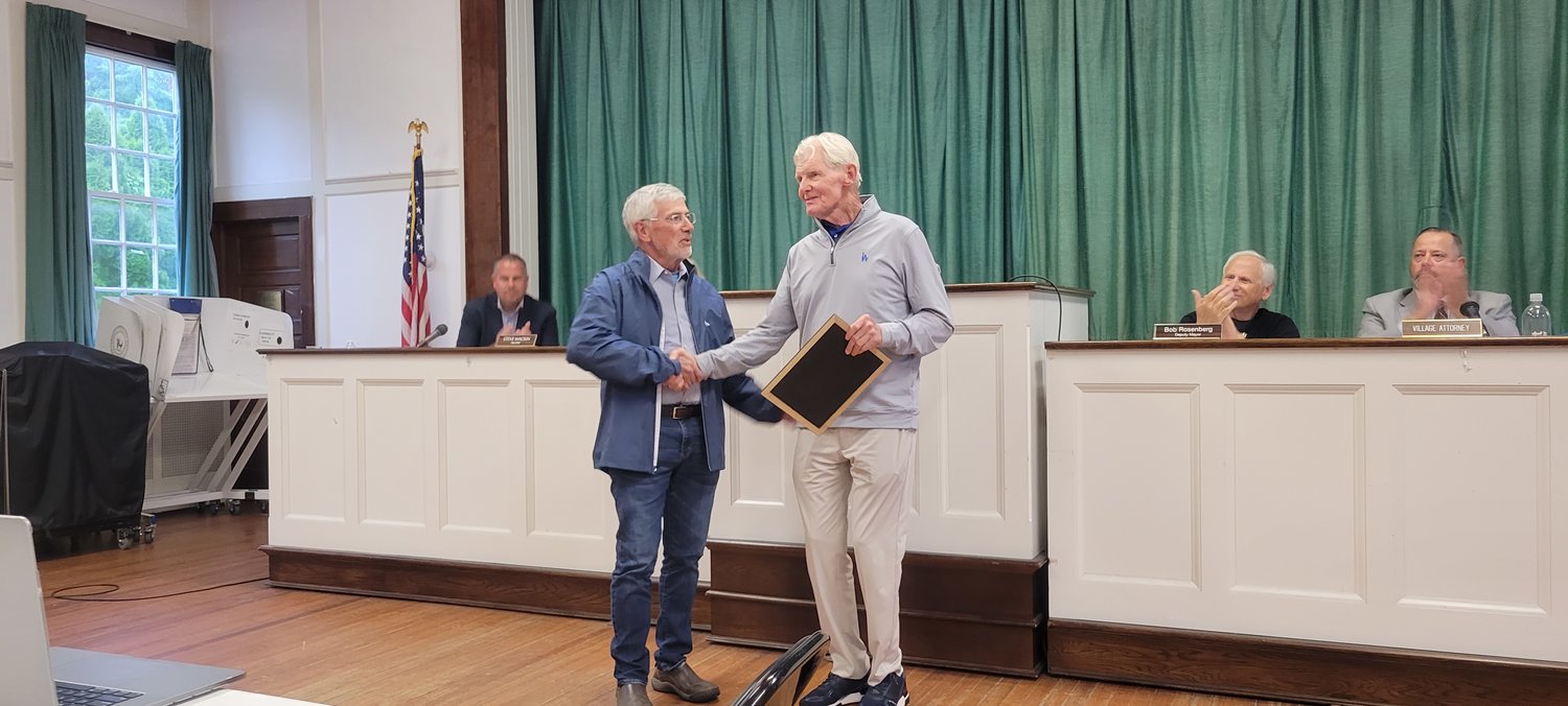Mayor Ray Fell (right) presents Brian Hannon (left), former chairperson of the Historic Preservation Commission, with a Certificate of Appreciation.